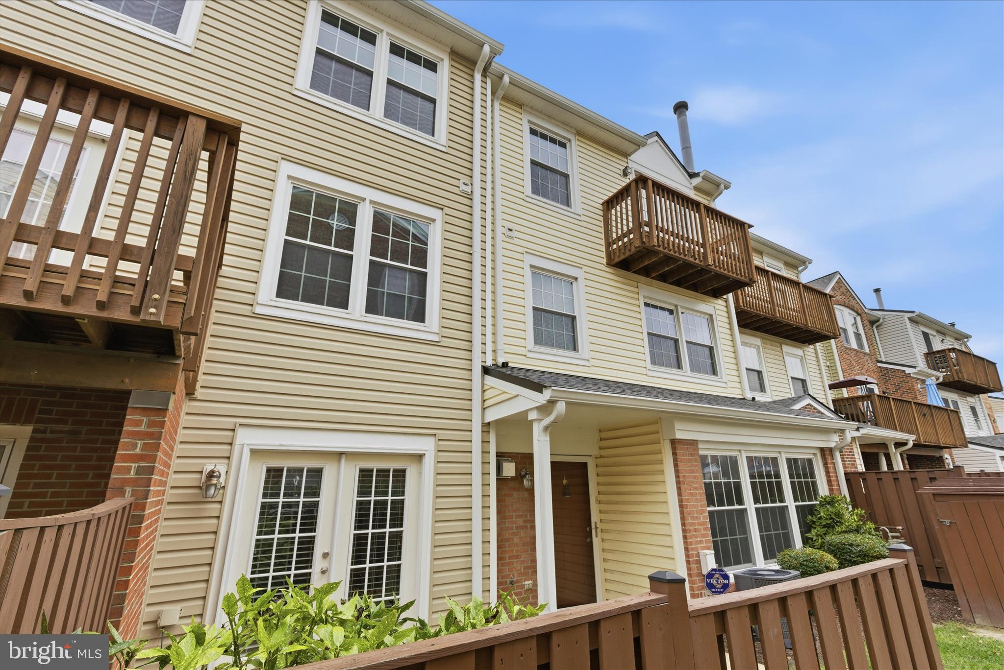4167 Churchman Way Woodbridge, VA 22192 - Photo 3 of 36 a front view of a house with large windows