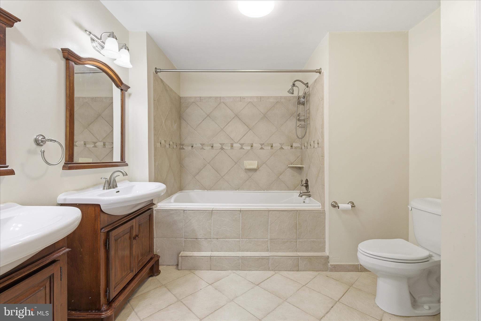 4167 Churchman Way Woodbridge, VA 22192 - Photo 32 of 36 a bathroom with a double vanity sink toilet and shower