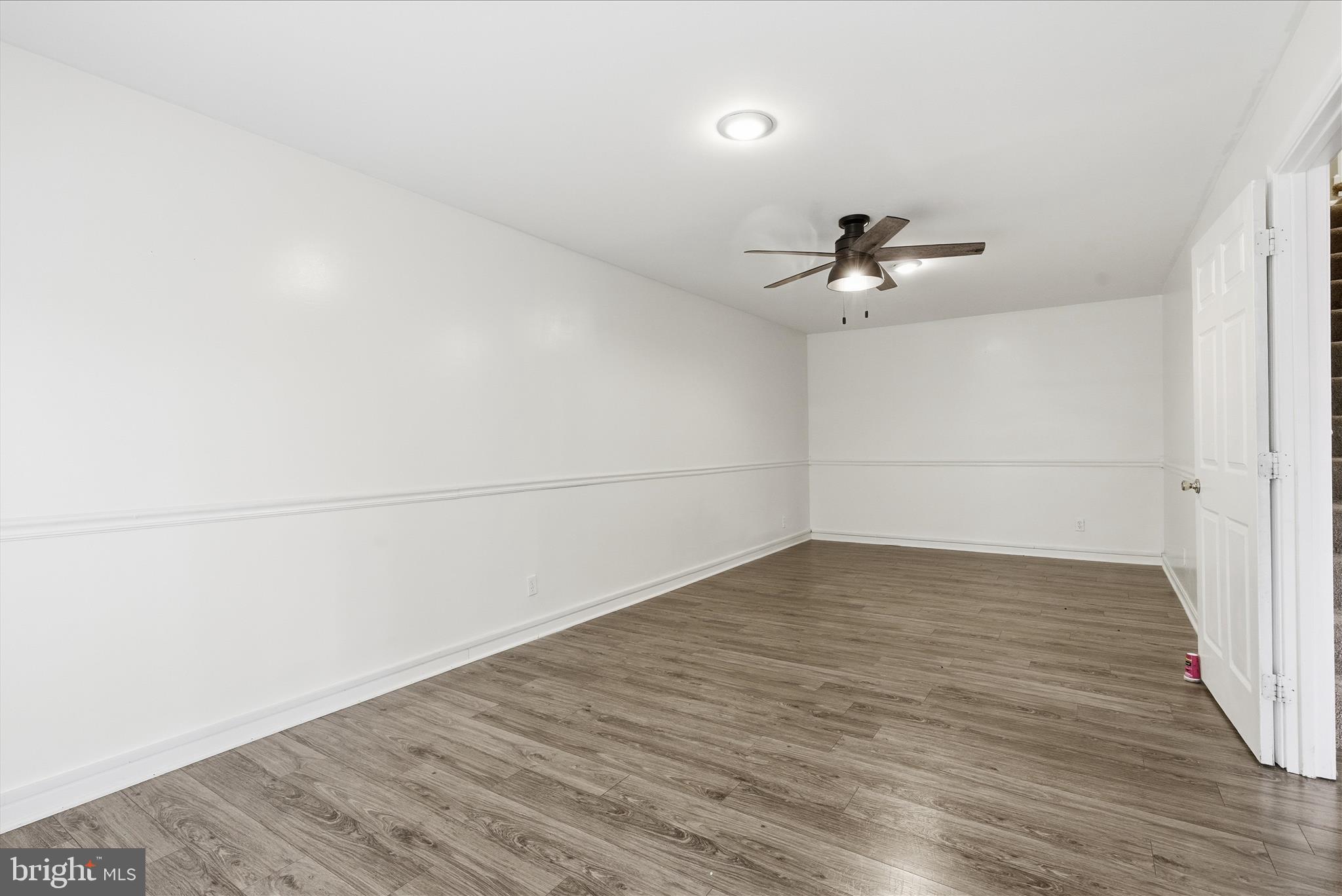 4167 Churchman Way Woodbridge, VA 22192 - Photo 34 of 36 wooden floor in an empty room