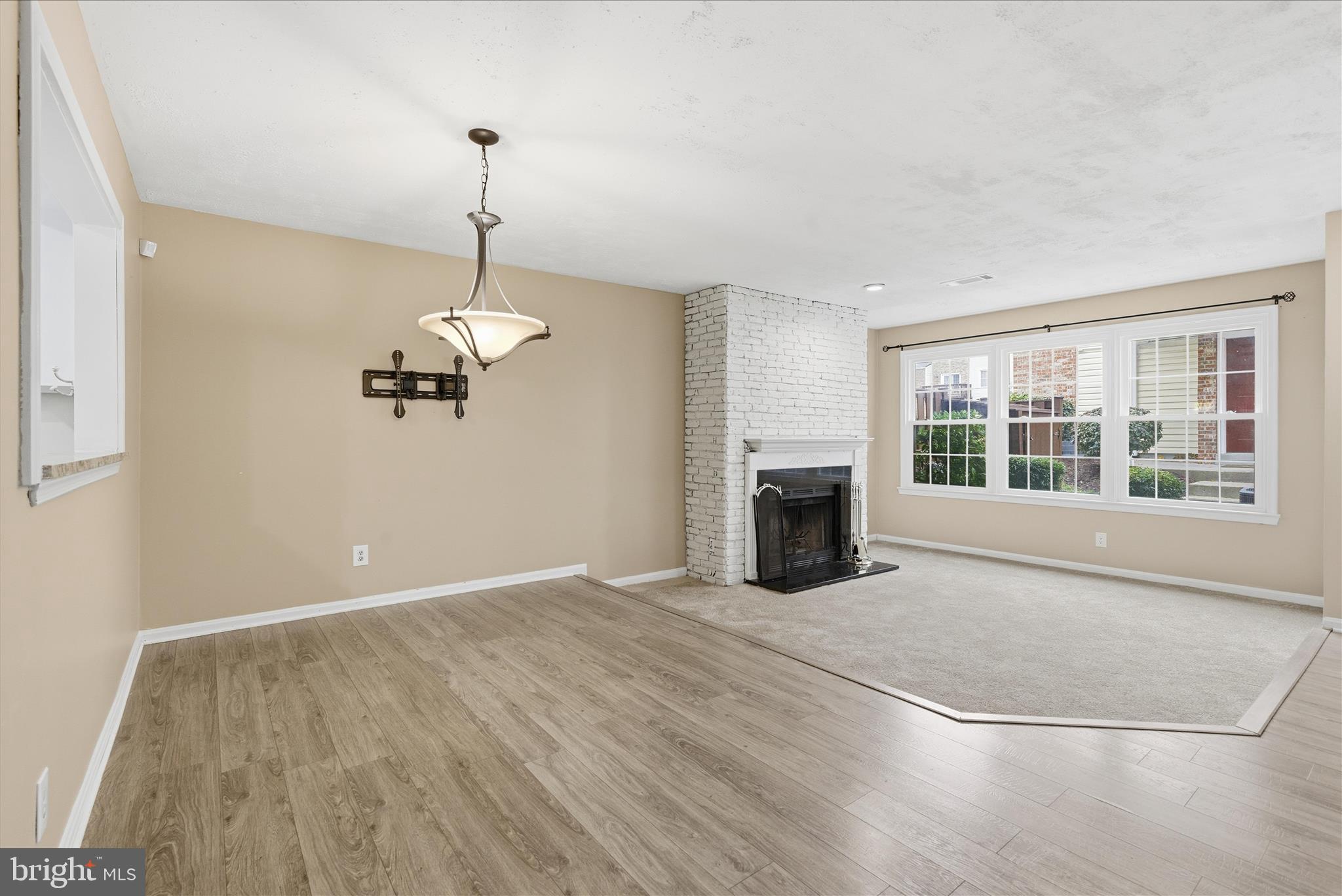 4167 Churchman Way Woodbridge, VA 22192 - Photo 9 of 36 a view of an empty room with a window and kitchen view