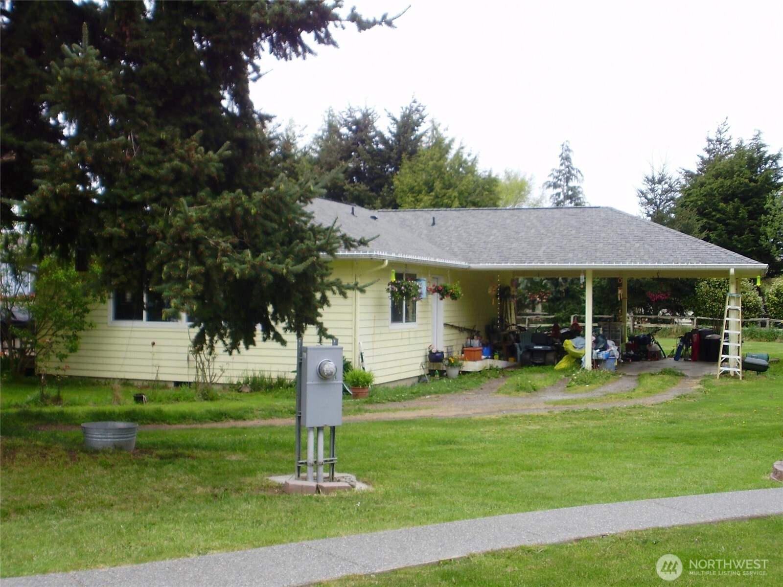 a view of a house with a yard porch and sitting area