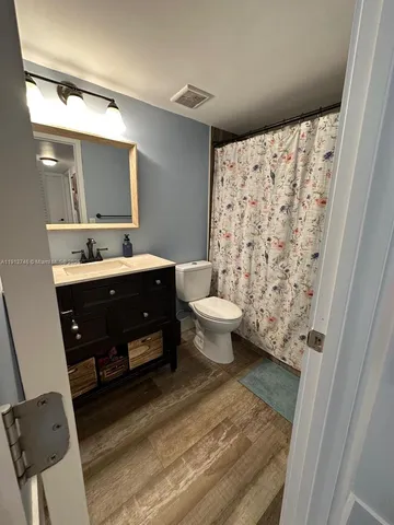 a room with a sink and a mirror