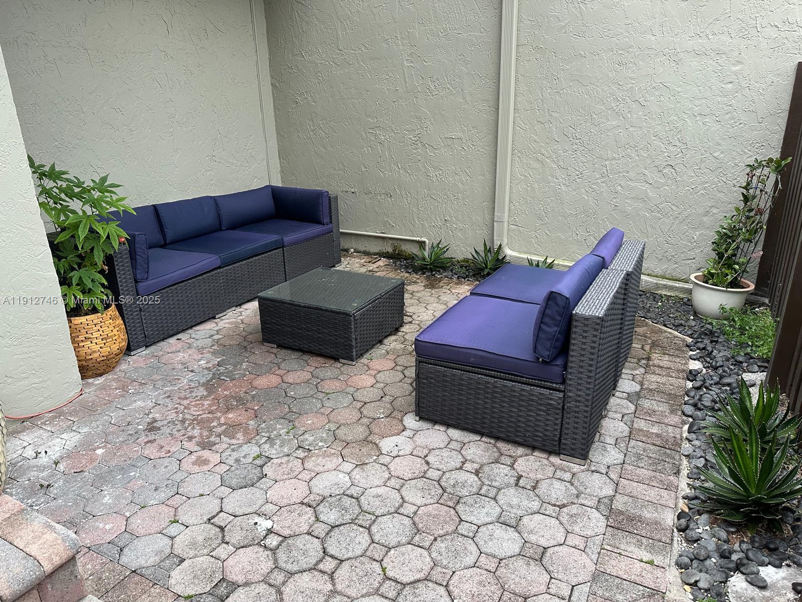 10040 Northwest 9th St Circle, Unit 202 Miami, FL 33172 - Photo 15 of 17 a living room with furniture