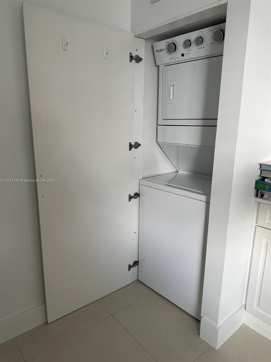 10040 Northwest 9th St Circle, Unit 202 Miami, FL 33172 - Photo 8 of 17 a view of white refrigerator with cabinet