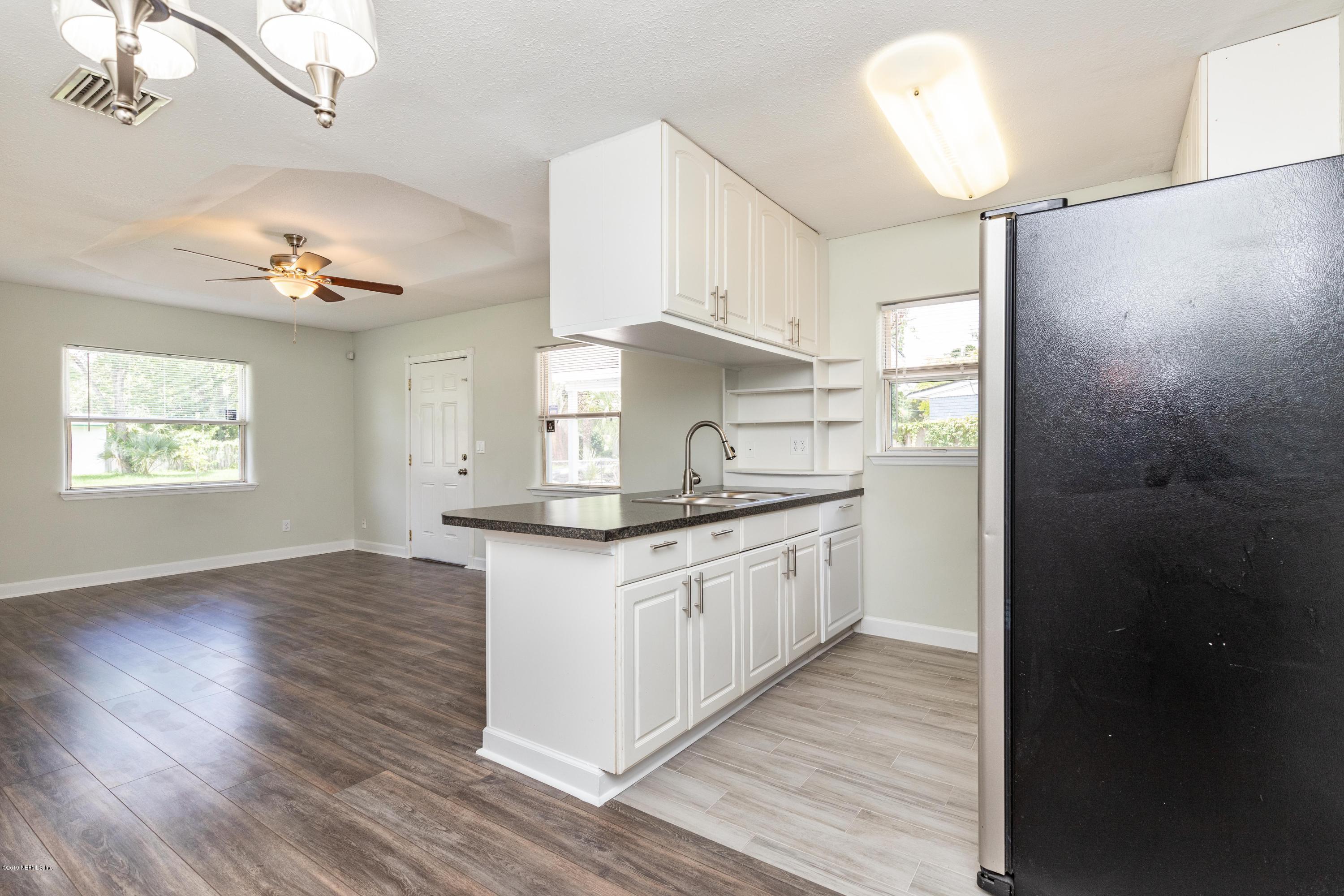 6750 Banbury Road Jacksonville, FL 32211 - Photo 21 of 45 a kitchen with stainless steel appliances granite countertop a stove a sink and a refrigerator