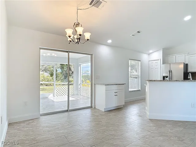 a view of a kitchen with a stove cabinets and wooden floor