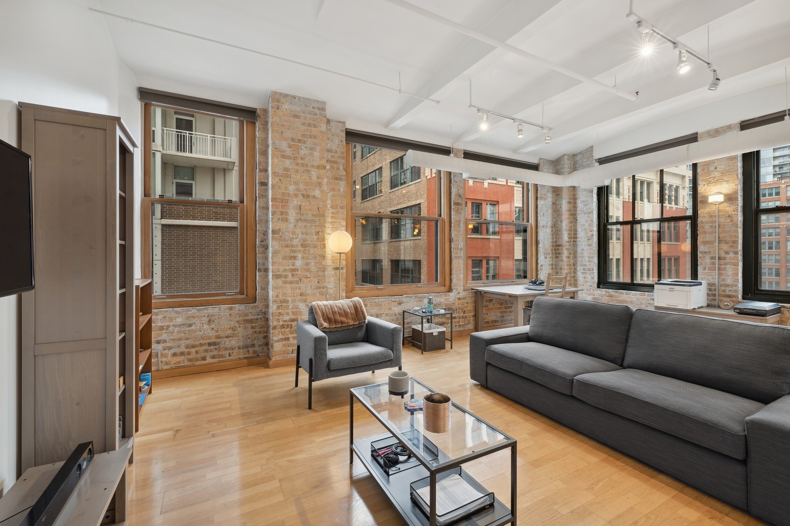801 South Wells Street, Unit 510 Chicago, IL 60607 - Photo 2 of 11 a living room with furniture and a window