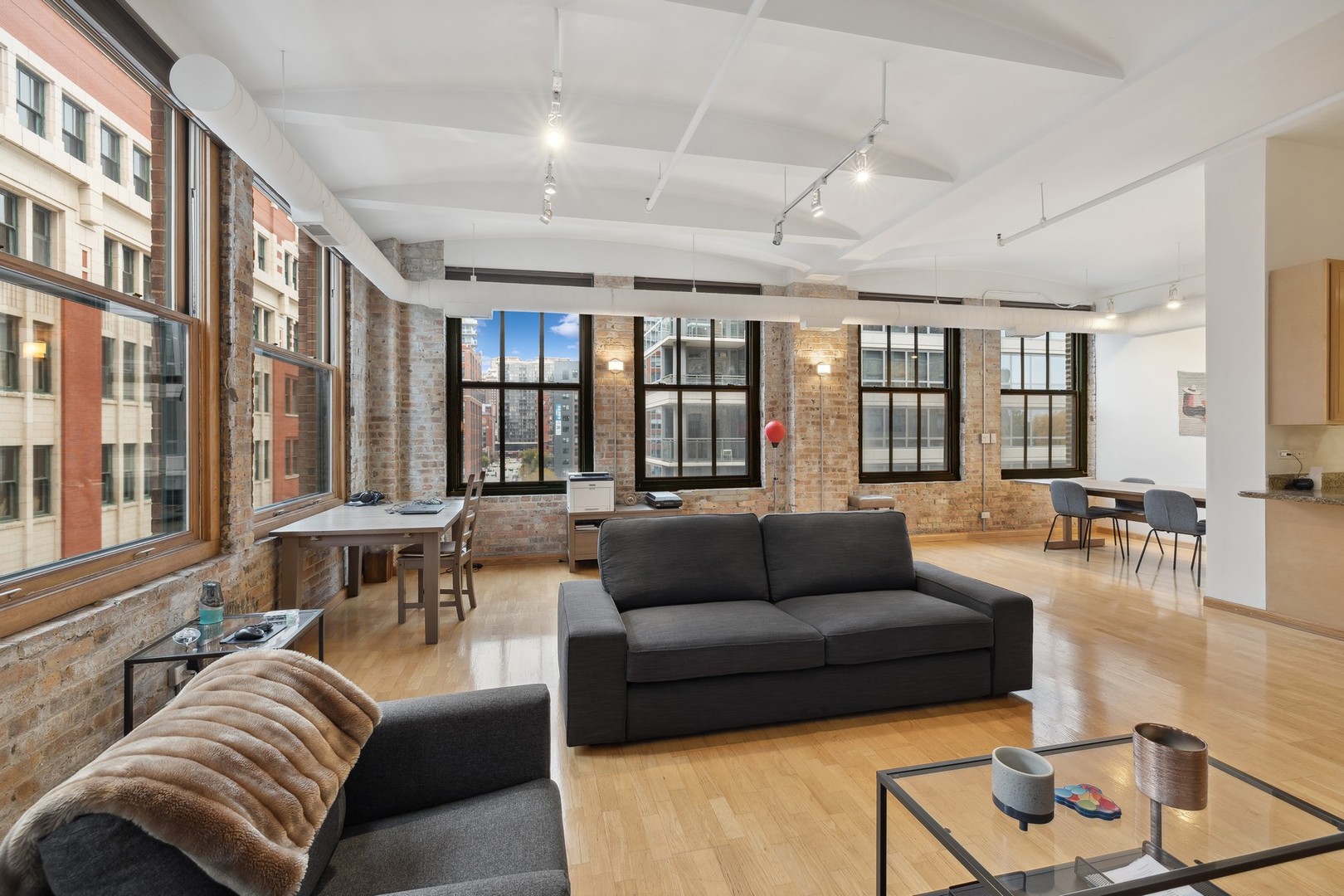 801 South Wells Street, Unit 510 Chicago, IL 60607 - Photo 3 of 11 a living room with furniture and a large window