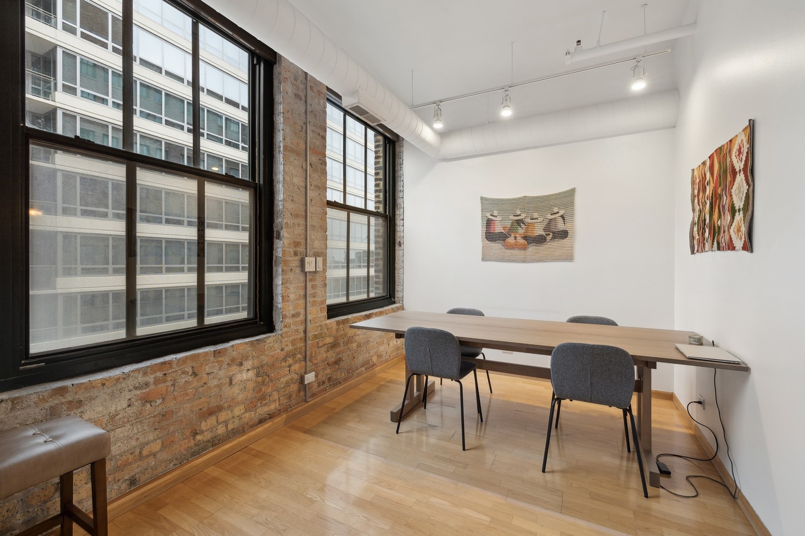 801 South Wells Street, Unit 510 Chicago, IL 60607 - Photo 4 of 11 a workspace with furniture window and wooden floor