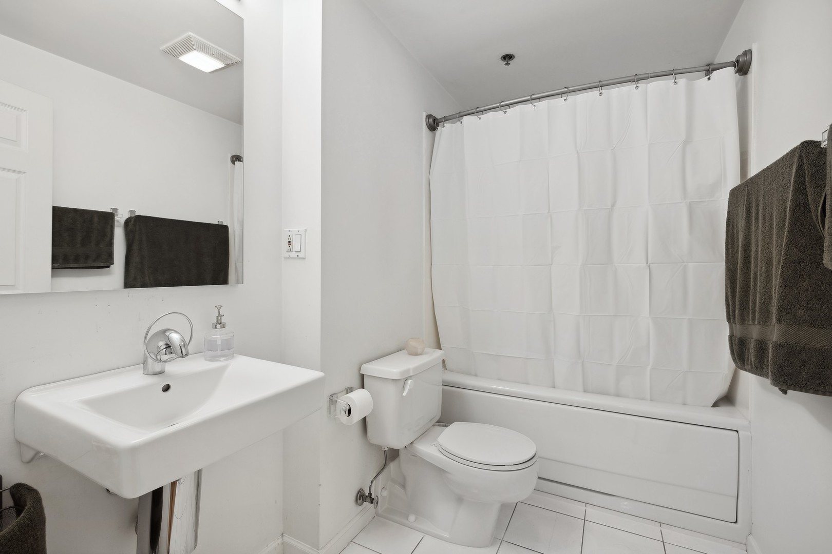 801 South Wells Street, Unit 510 Chicago, IL 60607 - Photo 8 of 11 a bathroom with a sink toilet and mirror