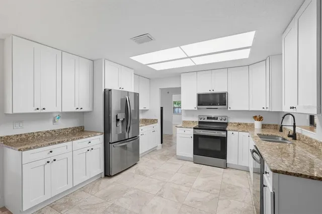 a kitchen with a sink and cabinets