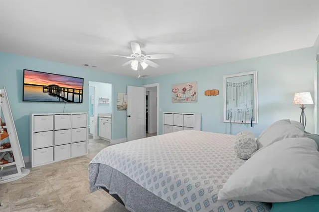 a bathroom with a granite countertop sink toilet and mirror