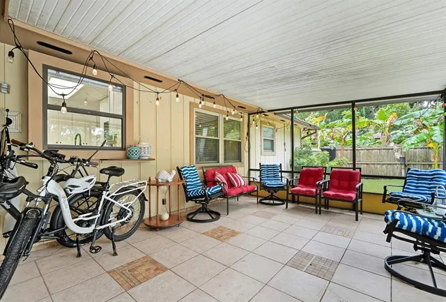 a view of house with a yard and outdoor seating