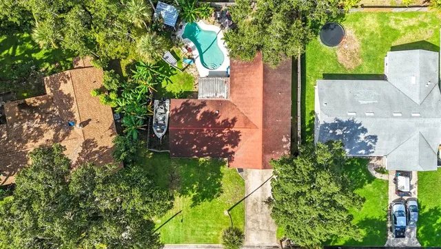 a view of a work space with furniture and floor to ceiling window