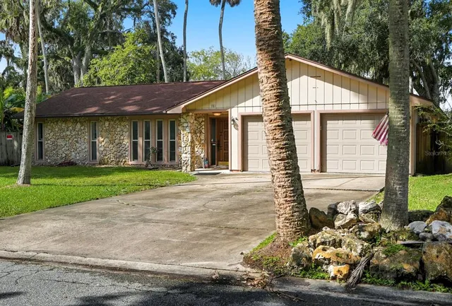 a view of backyard with a patio and outdoor seating