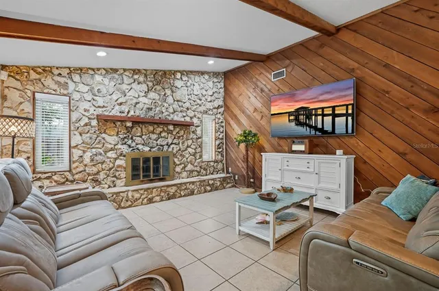 a living room with furniture and a table