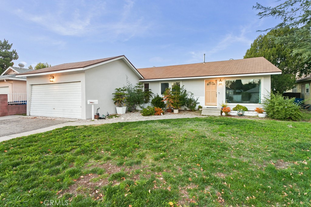 20509 Vose Street Winnetka, CA 91306 - Photo 1 of 1 a view of a house with backyard and garden