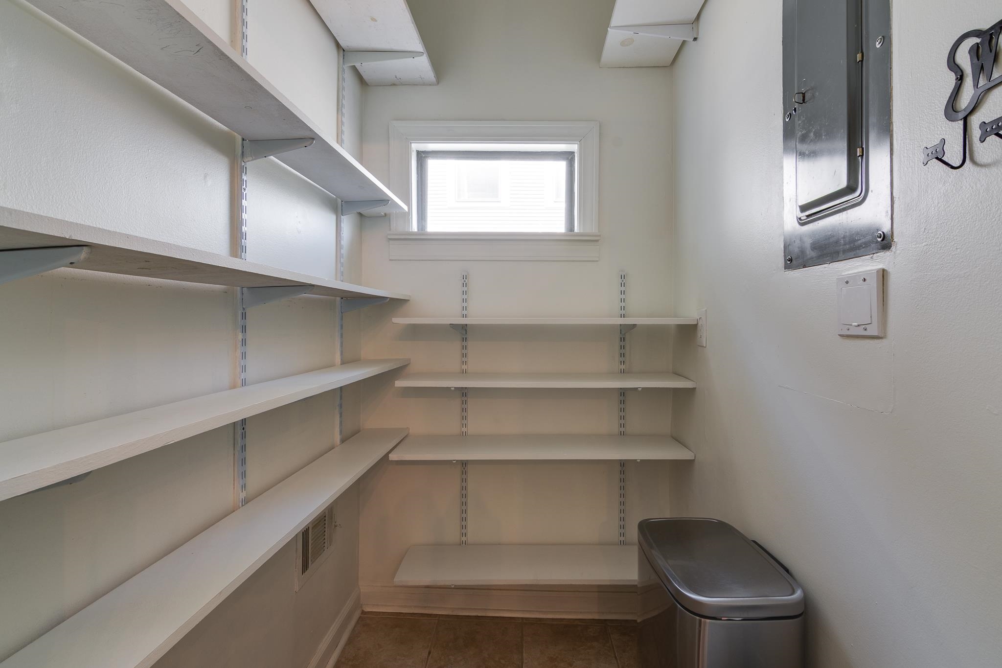 1680 Carruthers Place Memphis, TN 38112 - Photo 19 of 36 a view of storage and utility room with racks on the wall