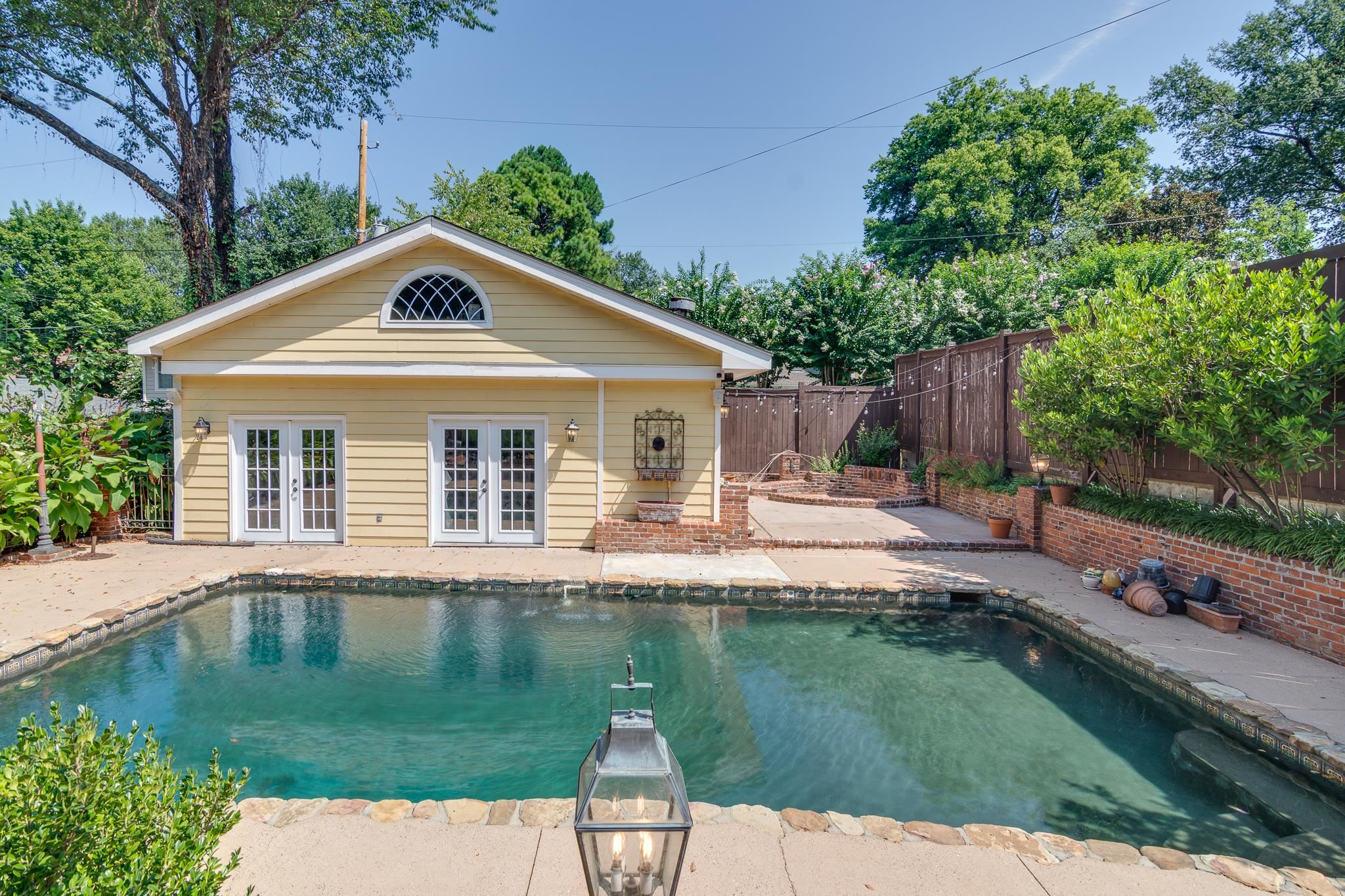 1680 Carruthers Place Memphis, TN 38112 - Photo 27 of 36 a front view of a house with a yard