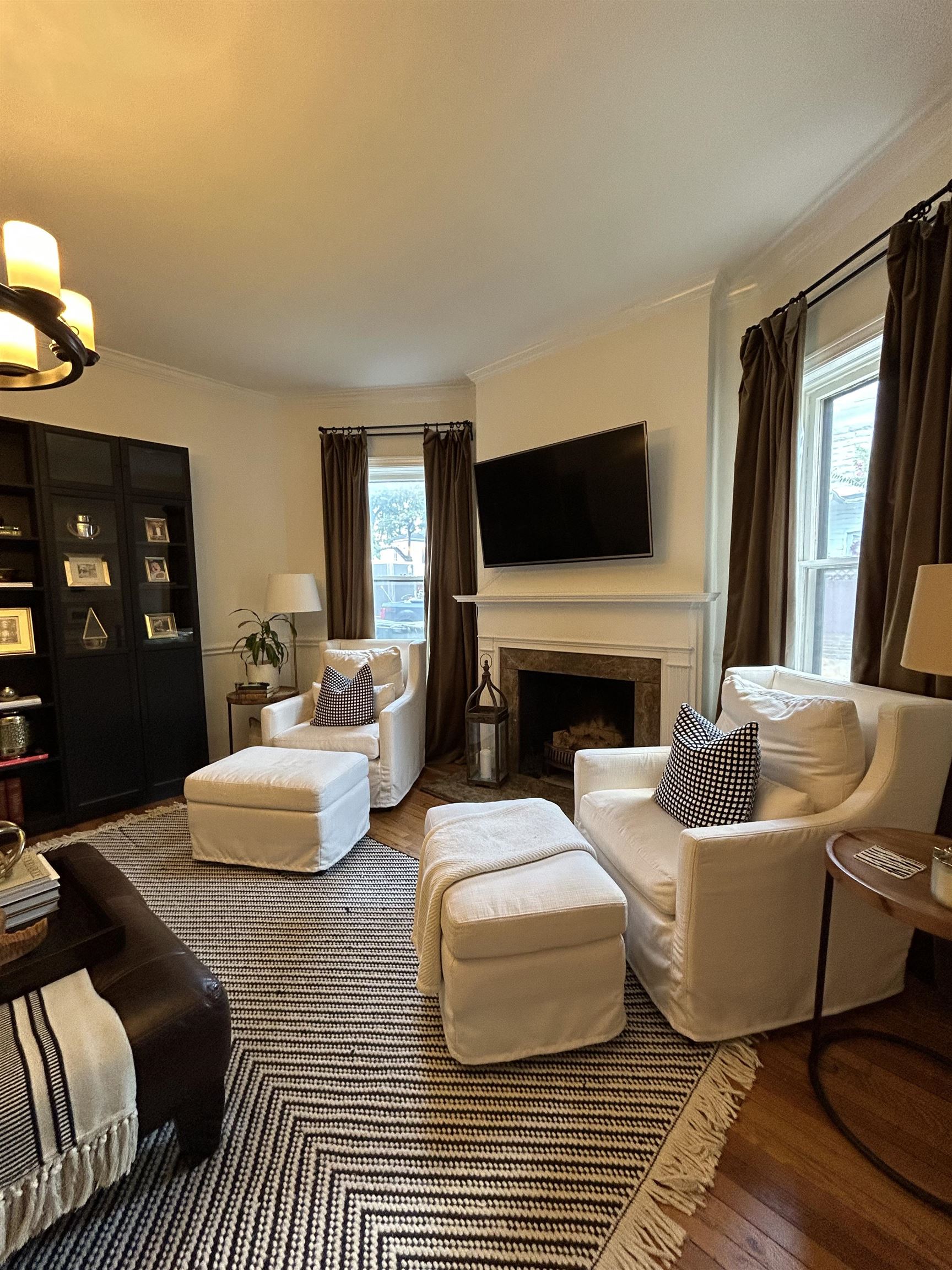 1680 Carruthers Place Memphis, TN 38112 - Photo 7 of 36 a living room with fireplace furniture and a flat screen tv