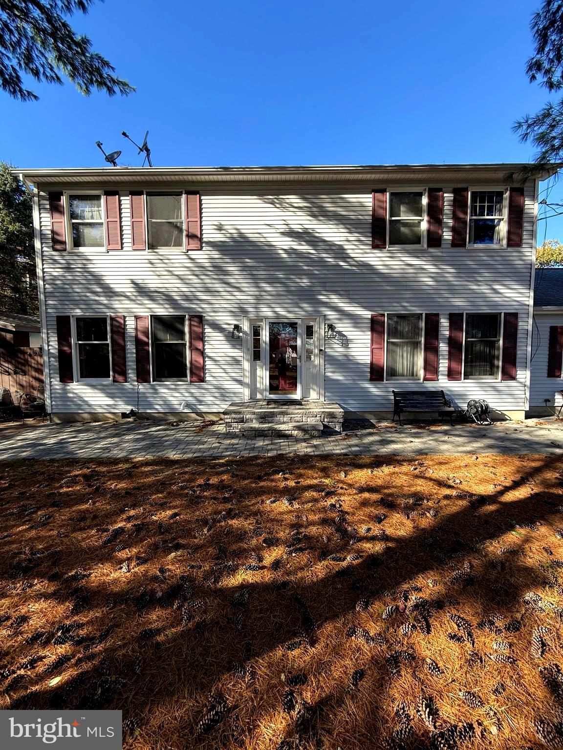 a front view of a building with a ocean view