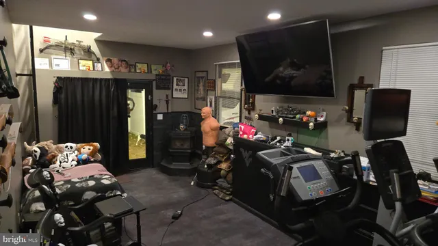 a room with furniture and a flat screen tv