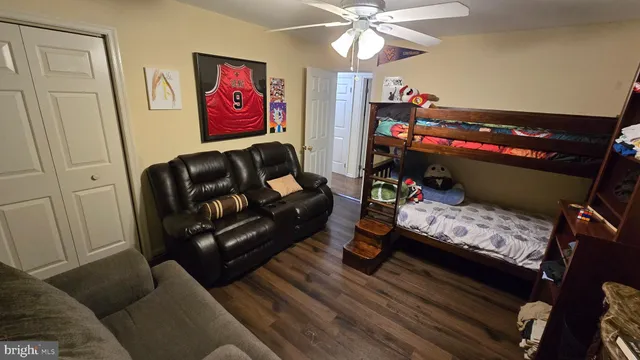 a bedroom with furniture and a chandelier