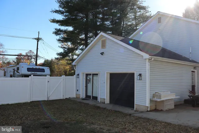 a view of a house with a yard and garage