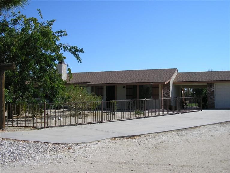 4515 Duncan Road Phelan, CA 92371 - Photo 1 of 1 a view of a house with a fence
