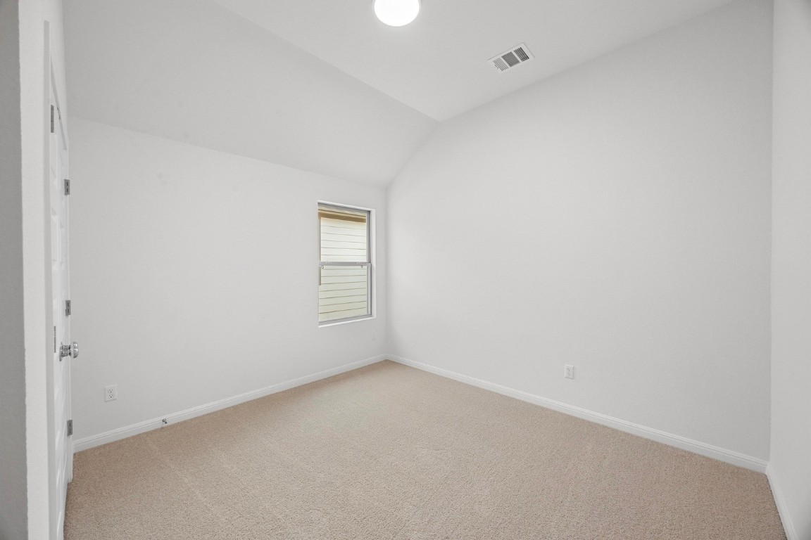 298 Bendecido Loop Elgin, TX 78621 - Photo 14 of 40 a view of an empty room and a window
