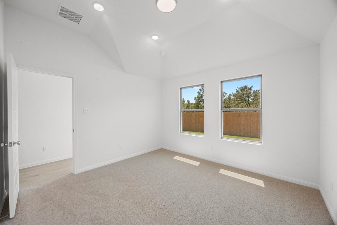 298 Bendecido Loop Elgin, TX 78621 - Photo 22 of 40 an empty room with windows