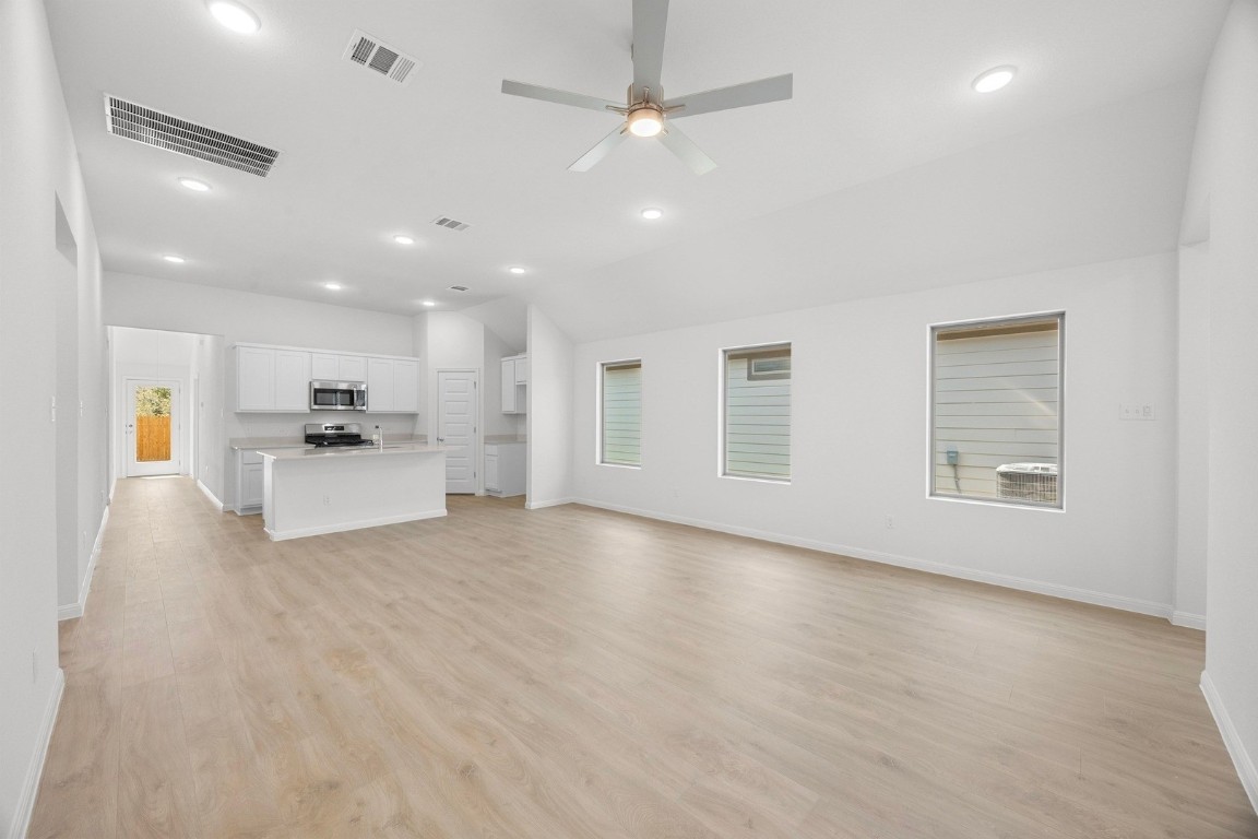 298 Bendecido Loop Elgin, TX 78621 - Photo 9 of 40 a view of kitchen with refrigerator and window