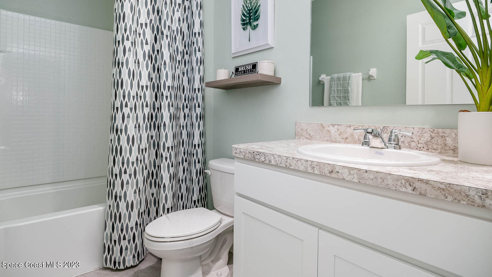 5368 Waterfall Place Grant, FL 32949 - Photo 18 of 50 a bathroom with a granite countertop sink toilet and shower