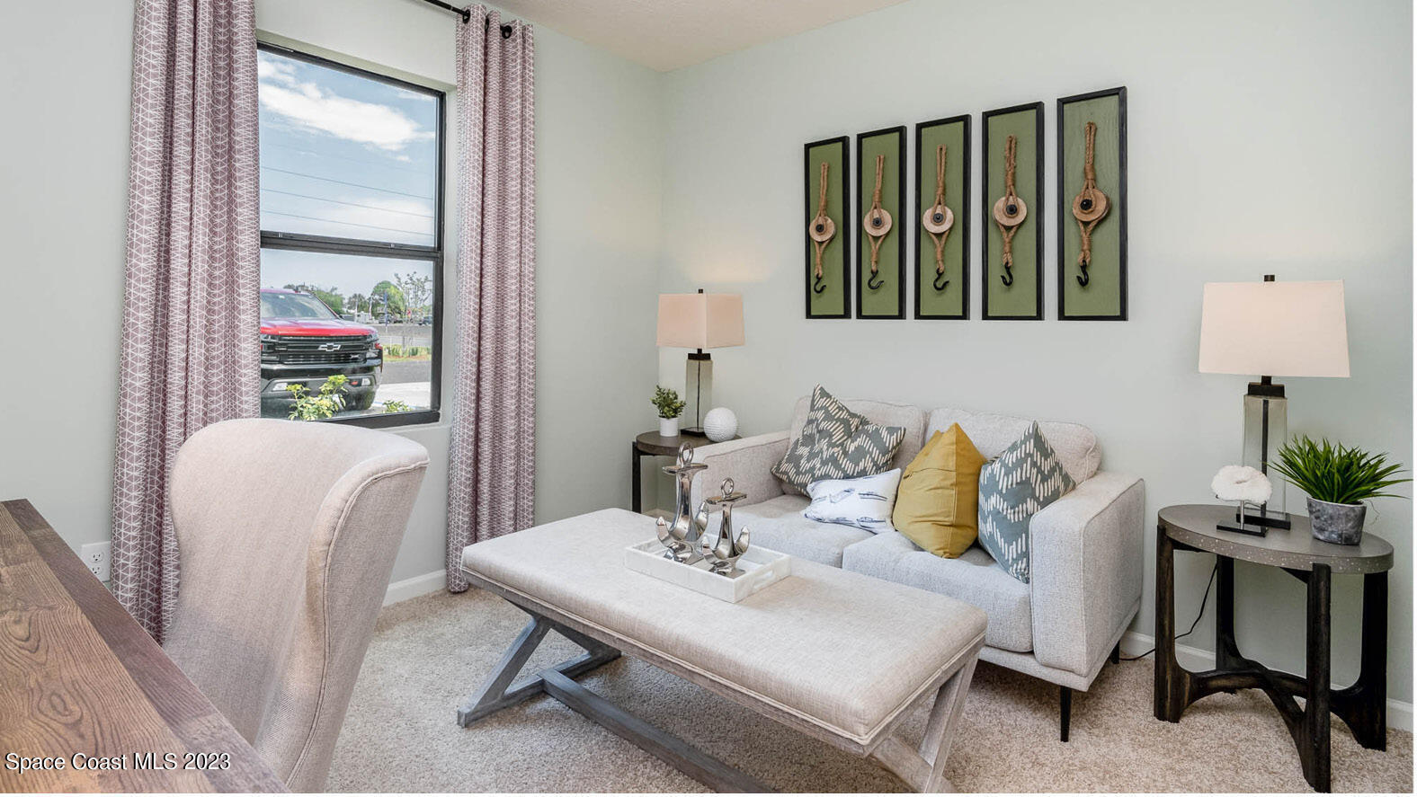 5368 Waterfall Place Grant, FL 32949 - Photo 21 of 50 a living room with furniture and a potted plant