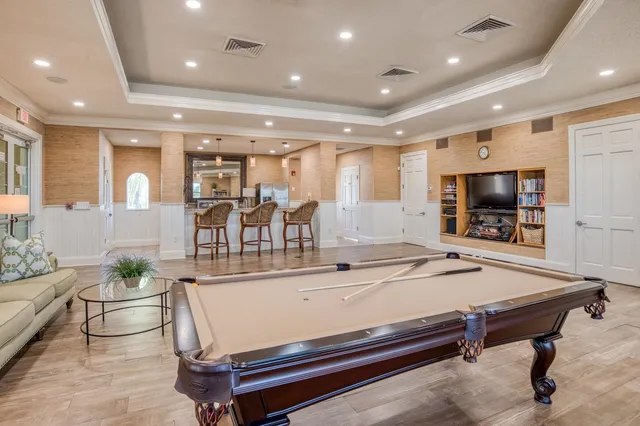 a room with stainless steel appliances furniture and kitchen view