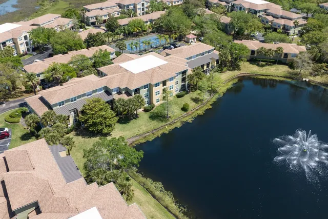 an aerial view of a house with a lake view