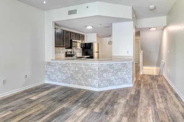 a view of a large kitchen with a sink