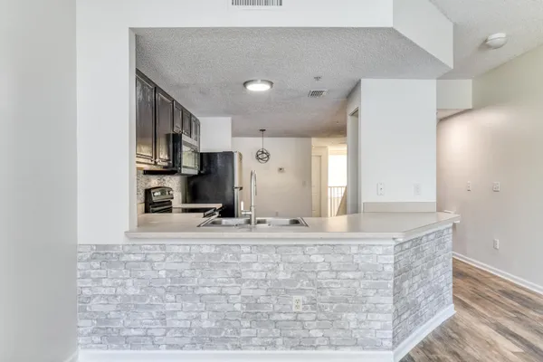 a view of kitchen island with cabinets