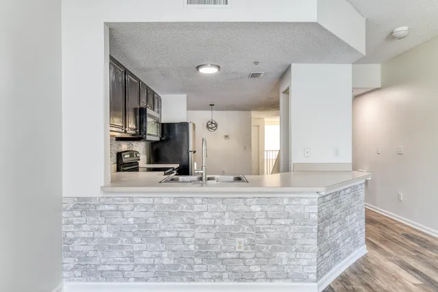 a view of kitchen island with cabinets