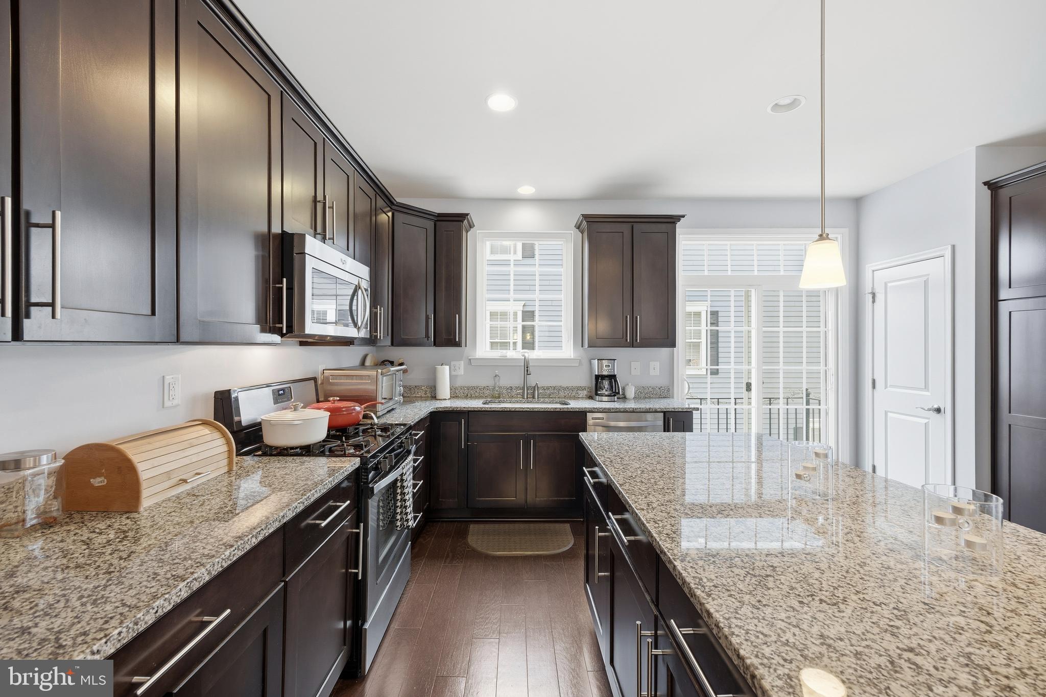 31 Meridian Lane Towson, MD 21286 - Photo 14 of 25 a kitchen with stainless steel appliances granite countertop sink stove refrigerator and cabinets
