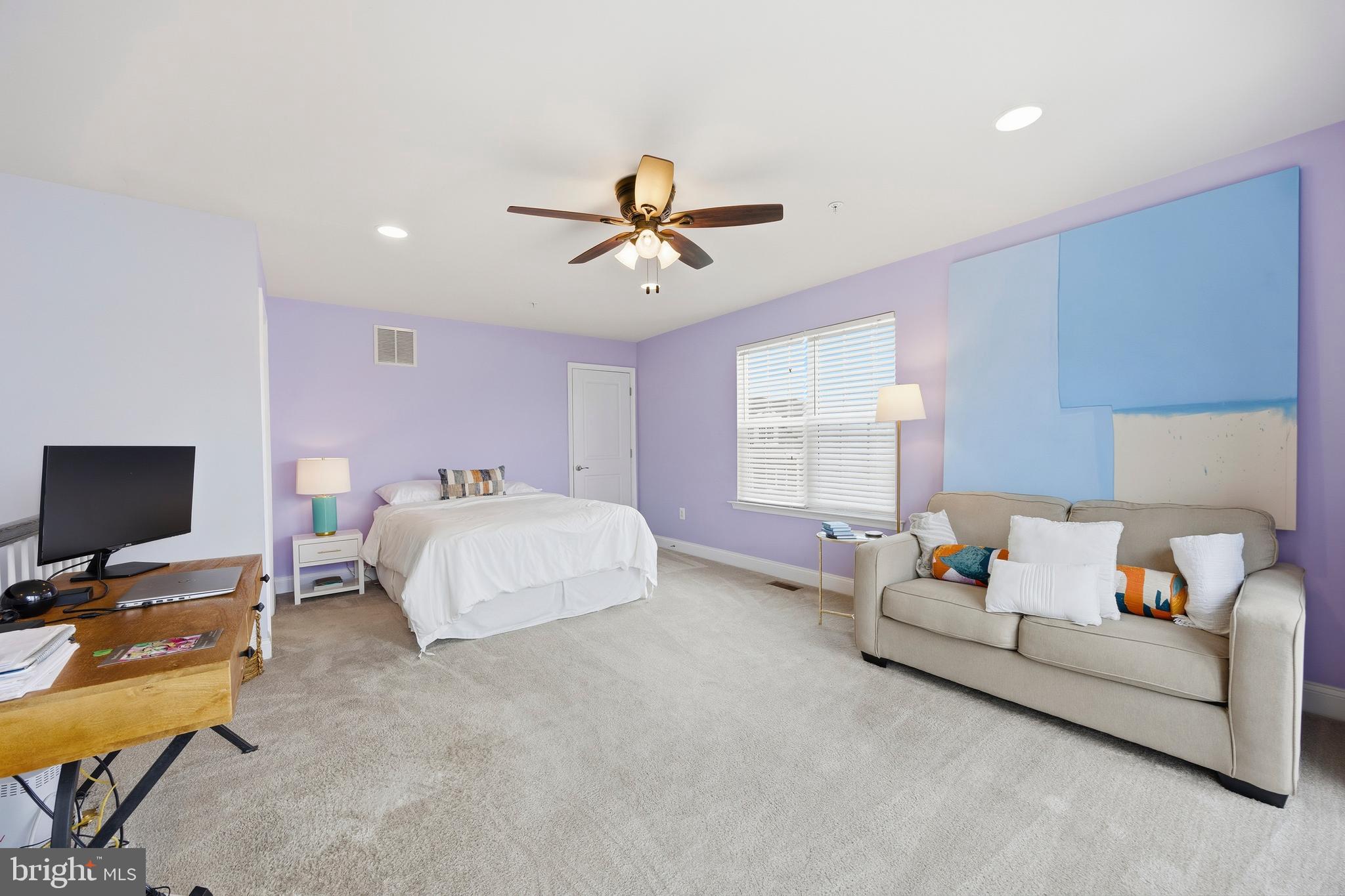 31 Meridian Lane Towson, MD 21286 - Photo 21 of 25 a bedroom with bed and a chandelier