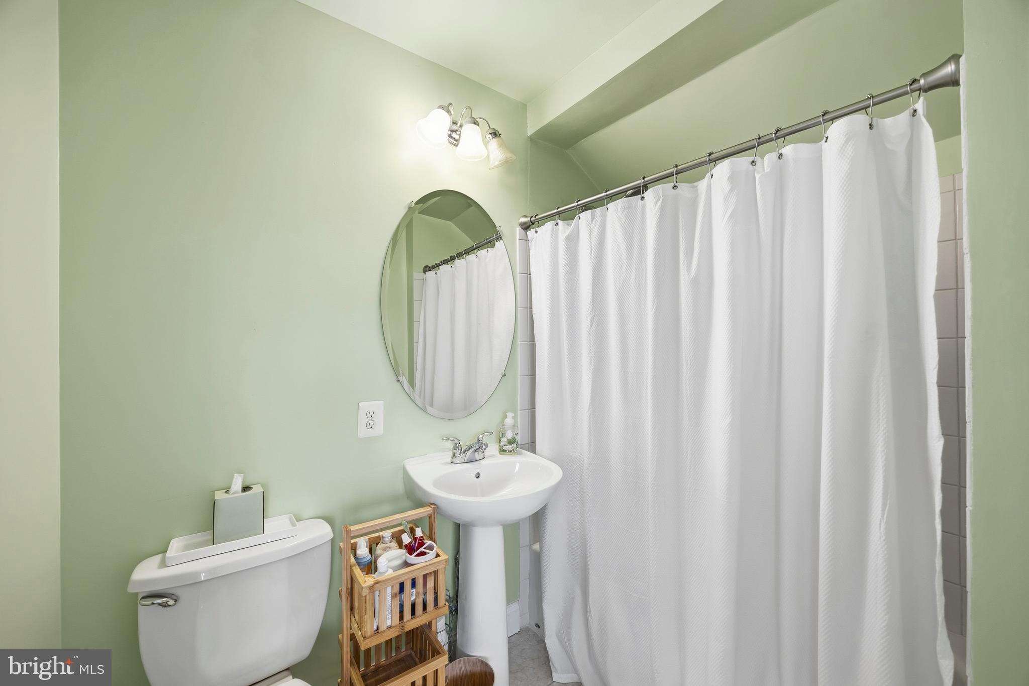 31 Meridian Lane Towson, MD 21286 - Photo 23 of 25 a bathroom with a sink toilet and a mirror