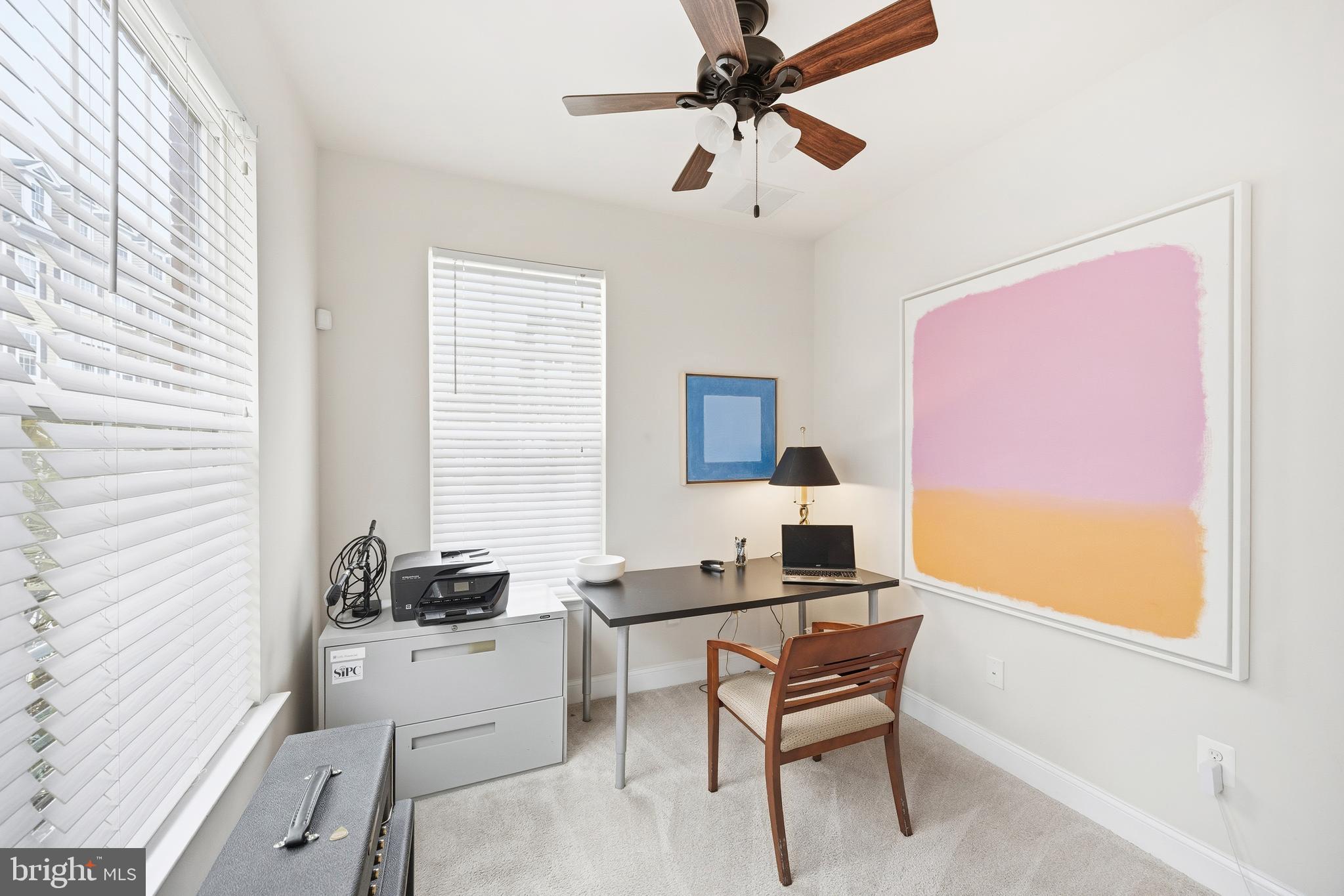 31 Meridian Lane Towson, MD 21286 - Photo 3 of 25 a workspace with furniture and a window