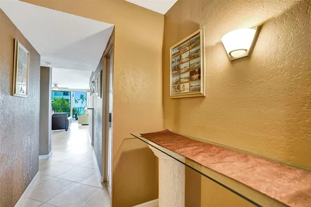 a living room with furniture and floor to ceiling window