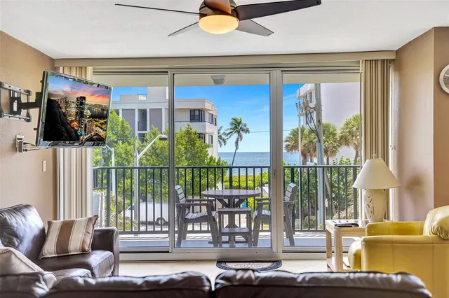 a kitchen with stainless steel appliances kitchen island granite countertop a refrigerator and a sink