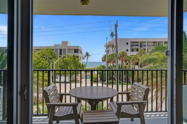 a view of a balcony with chairs