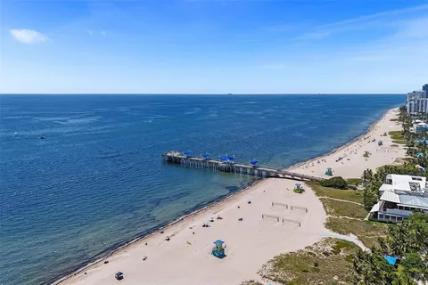 a view of swimming pool with outdoor seating