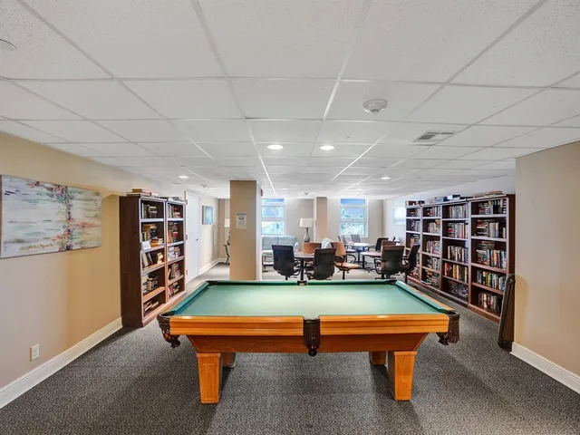a view of a patio with a table and chairs