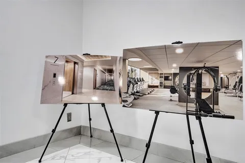 a front view of a building with a garden