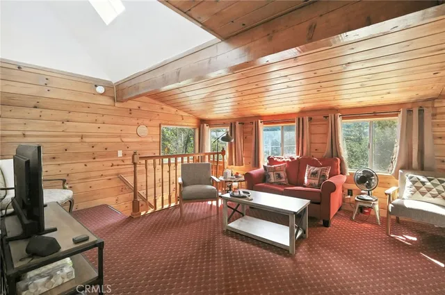a outdoor space with patio the couches and a dining table with the view of the ocean